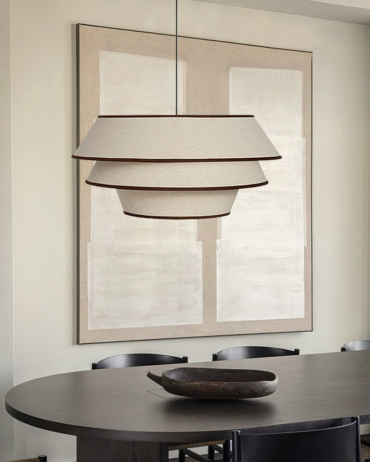 A pair of Auden Pendant Lights hanging over a long kitchen island.