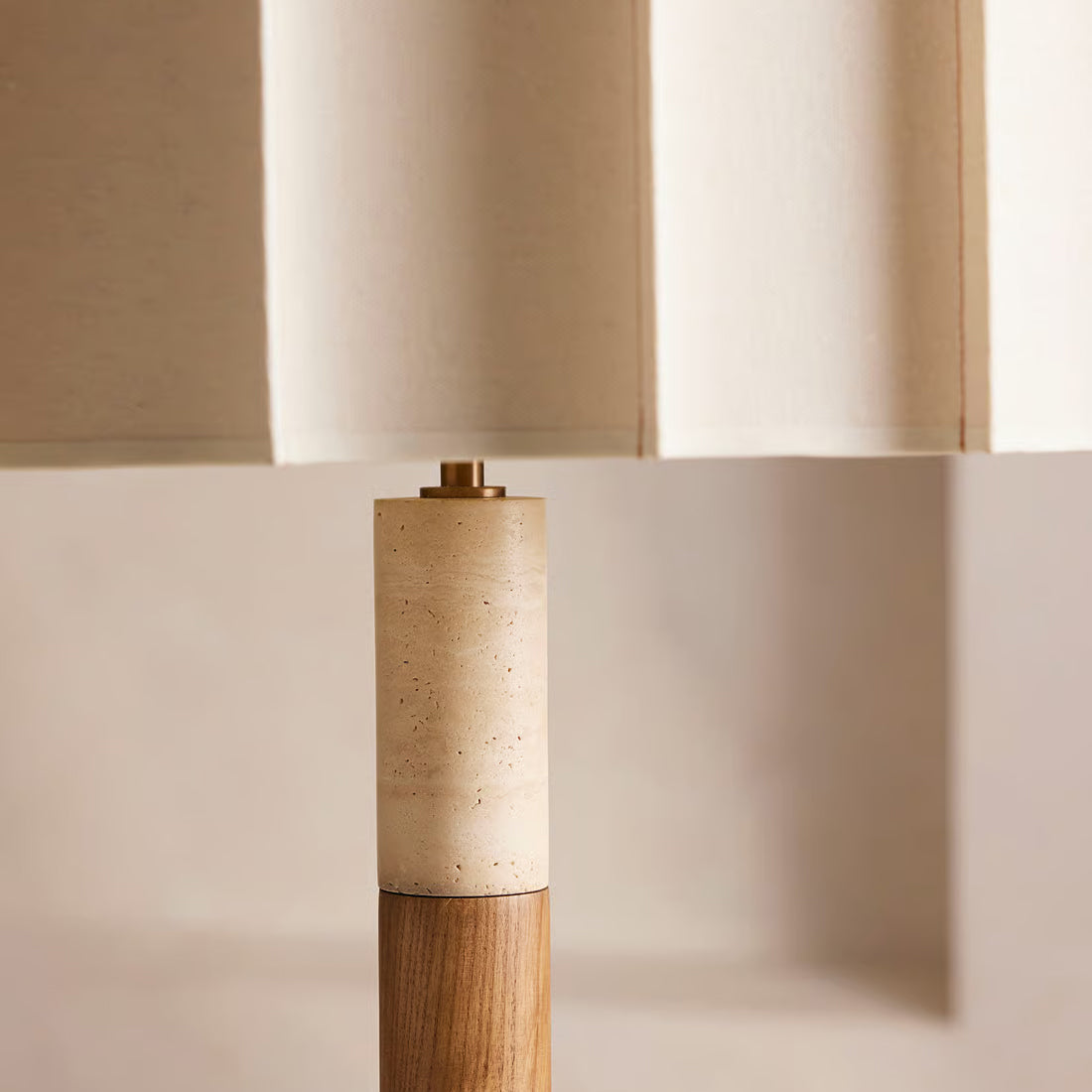 Detail shot of the pleated fabric drum shade of the Calypso lamp.