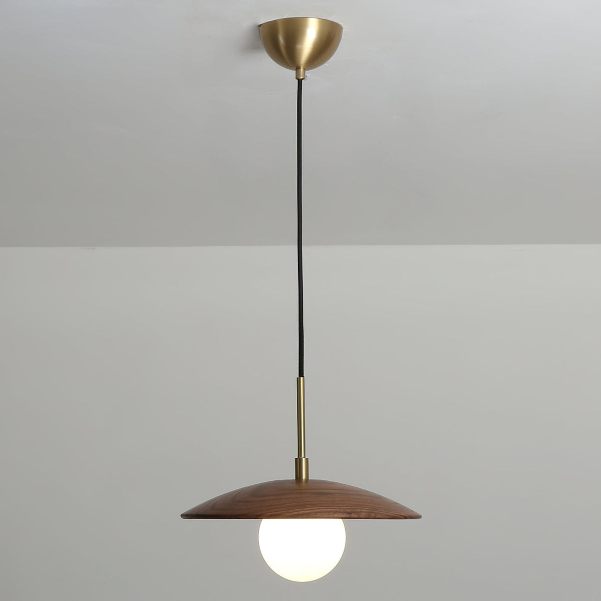 The Caroll Pendant Light in a cozy, well-lit interior space.