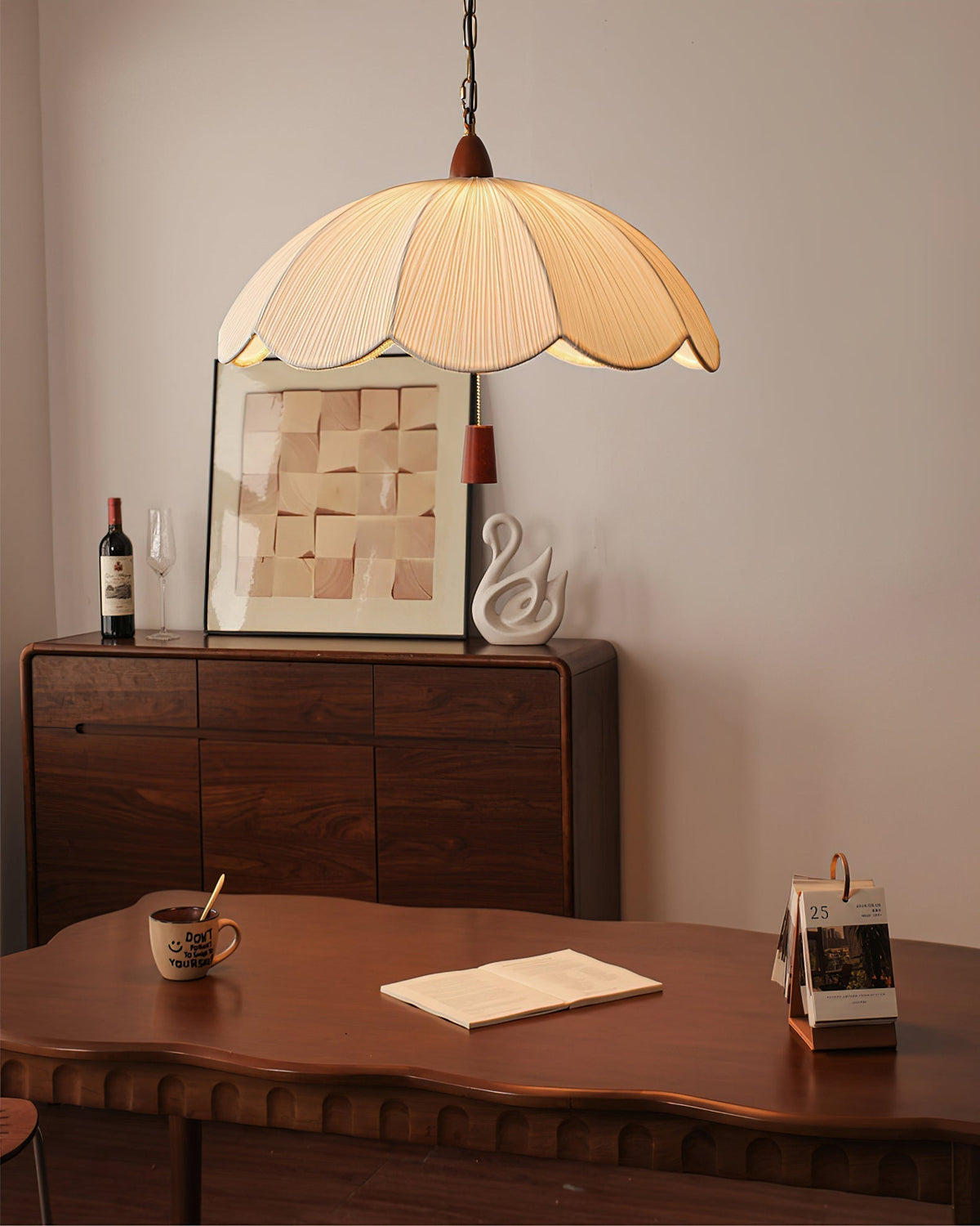 Dawson Pendant Light hanging over a modern dining table.