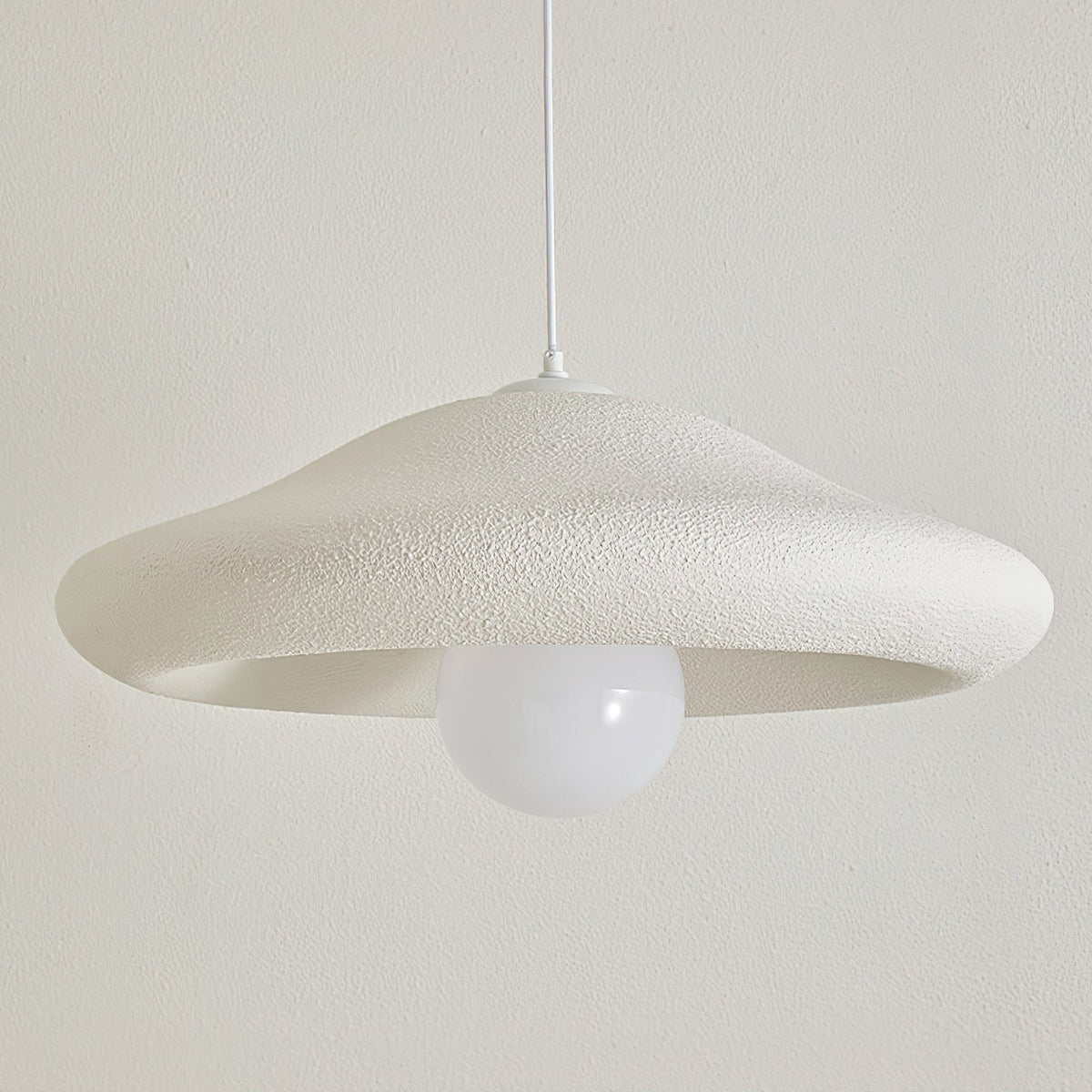Detail of the ceiling canopy and white cord for the Chalk Pendant Light.