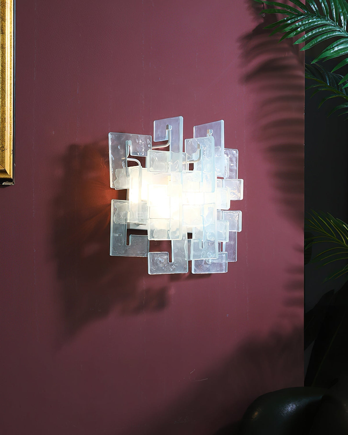 Front view of the Stagger Cast Glass Sconce in Amber finish.
