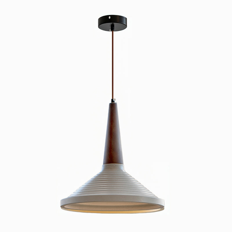 The grey cement Doherty Pendant Light in an industrial-style bedroom.