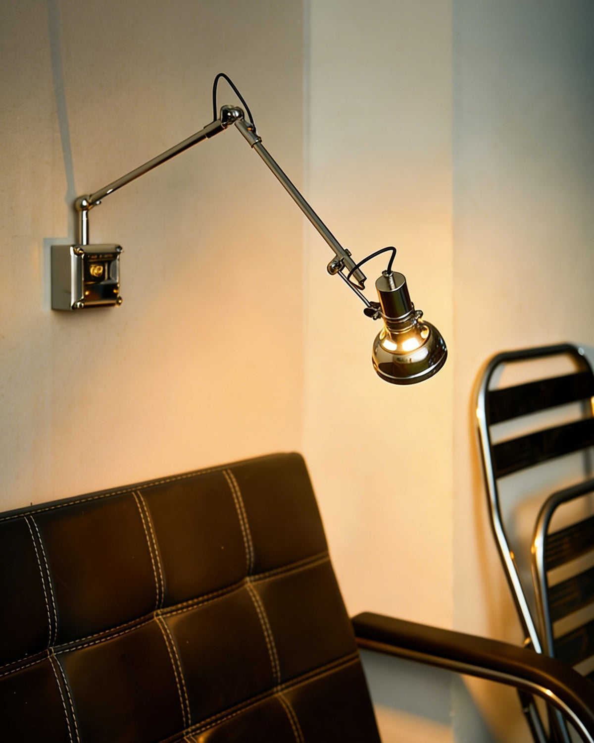 The sconce retracted against a wall as a sculptural piece