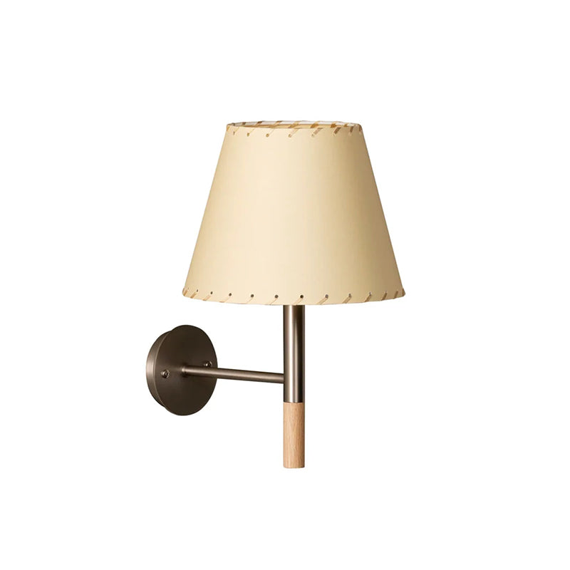 Angled view of the beige Kilkee Wall Lamp against a dark wall.