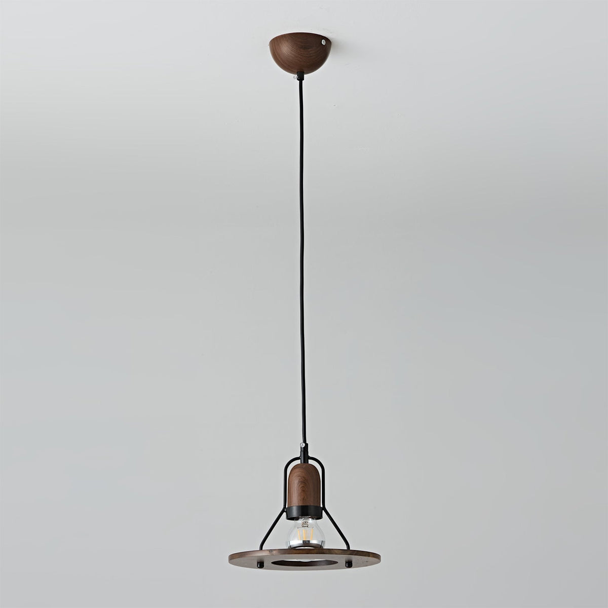 Lioren Pendant Lamp used as bedside lighting in a modern bedroom.