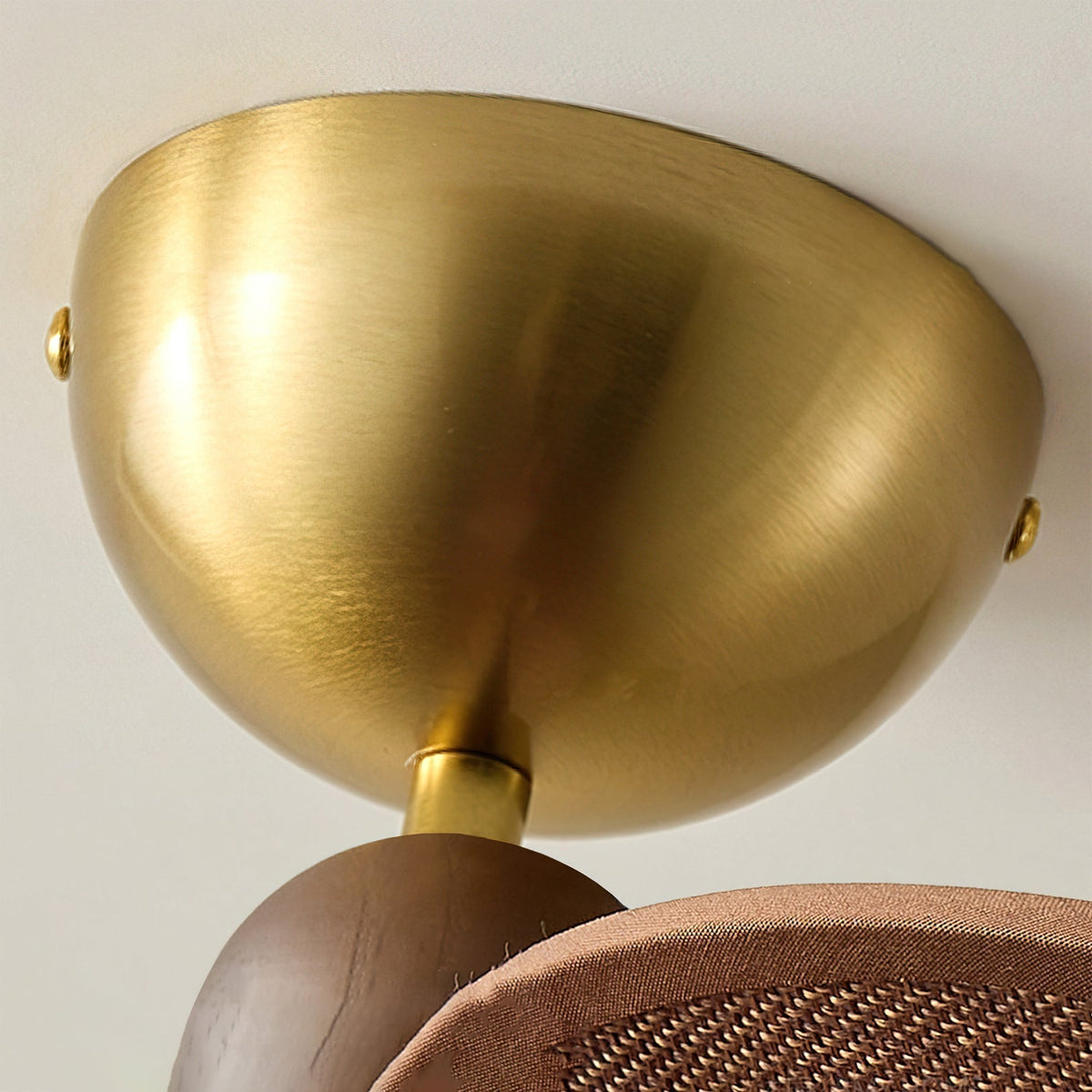 The Lucca Chandelier hanging over a dining table, providing warm ambient light.