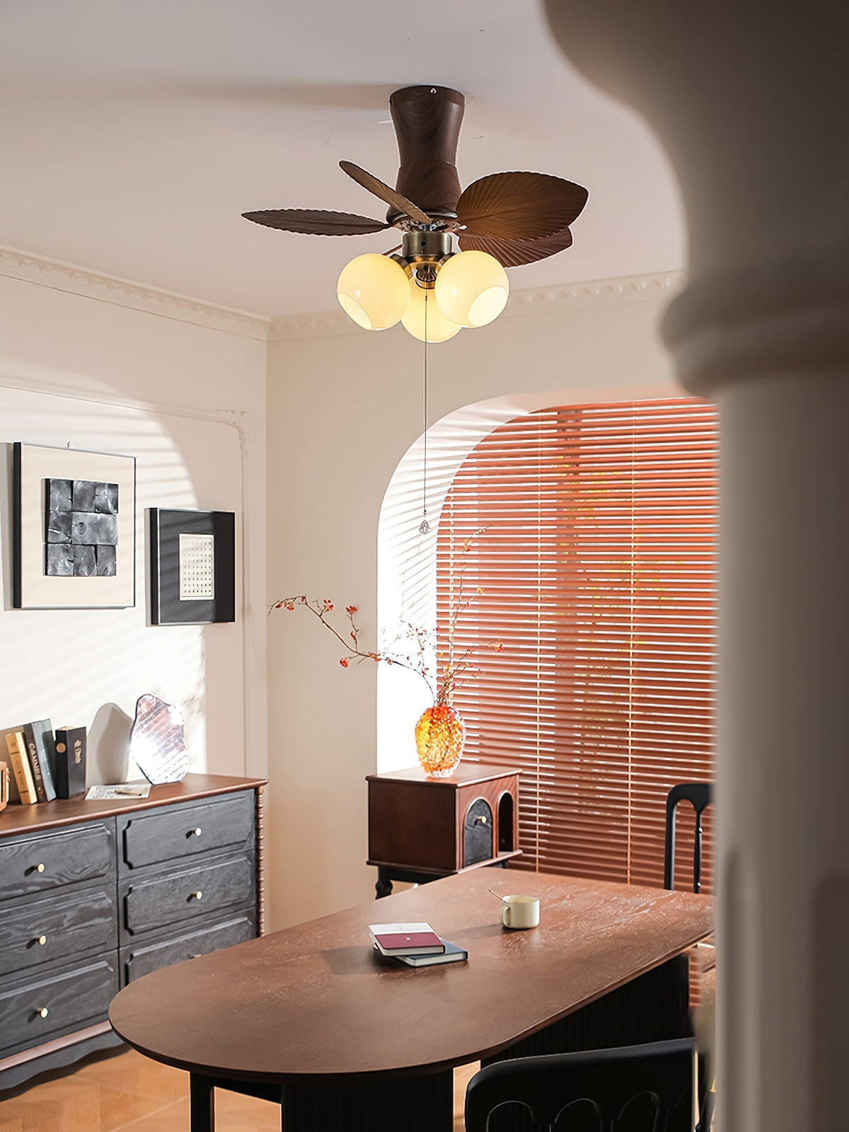 The light of the Malibu Ceiling Fan turned on, casting a warm glow.