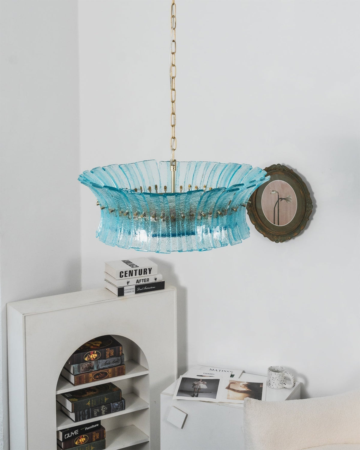 Lifestyle image of the Marin Chandelier in an upscale primary bedroom.