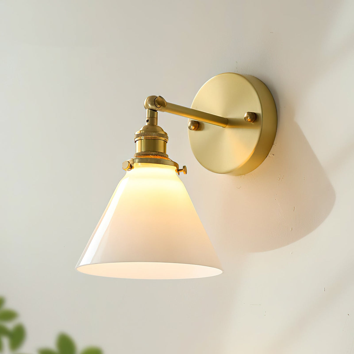 The Portland Swivel Wall Sconce mounted on a light gray wall.