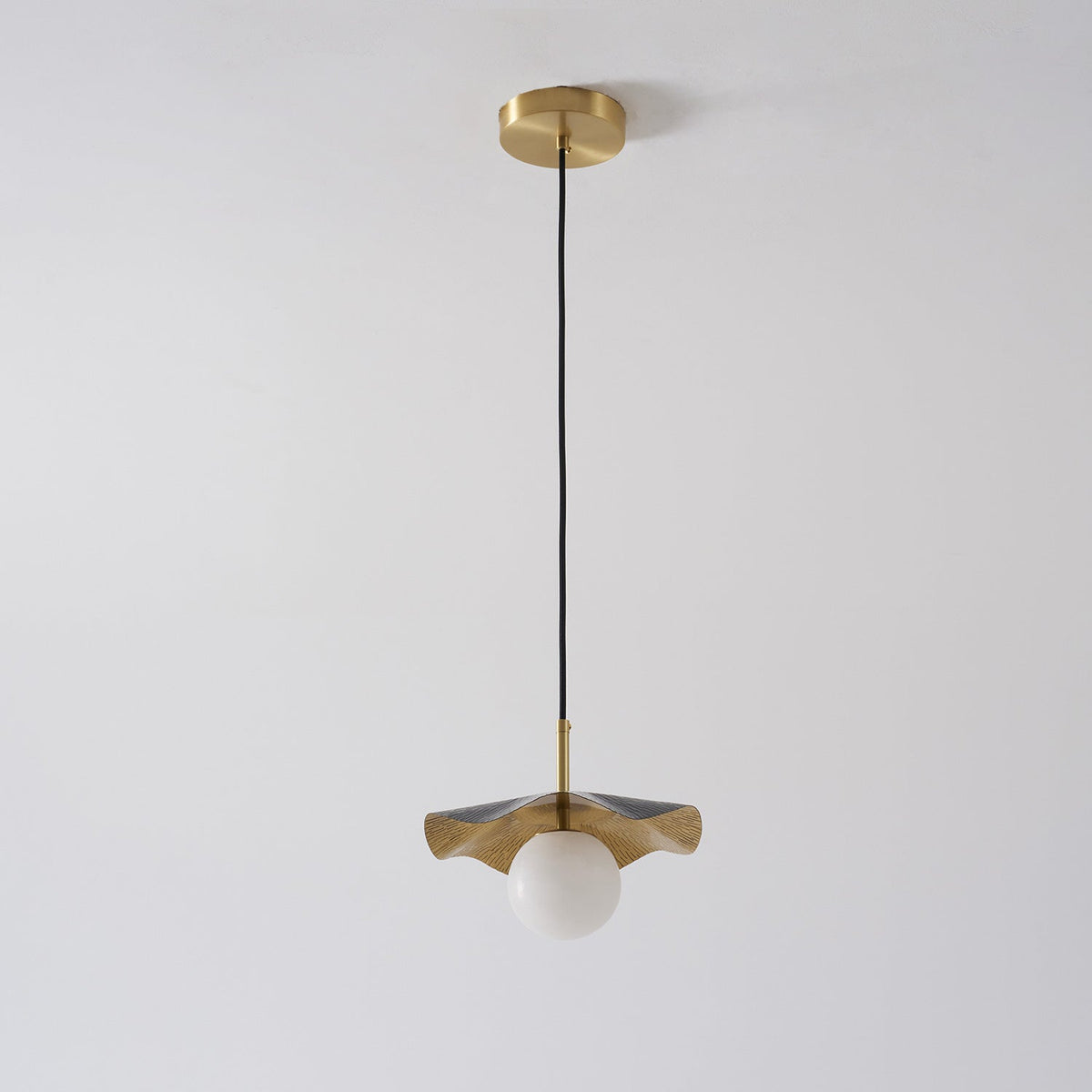Comparison of the brass, white, and black finish options for the Bonnie lamp.