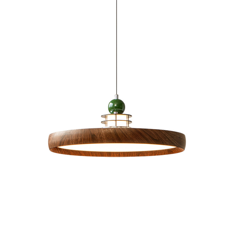 Close-up on the texture of the wood-grain finish on the walnut Sia pendant.