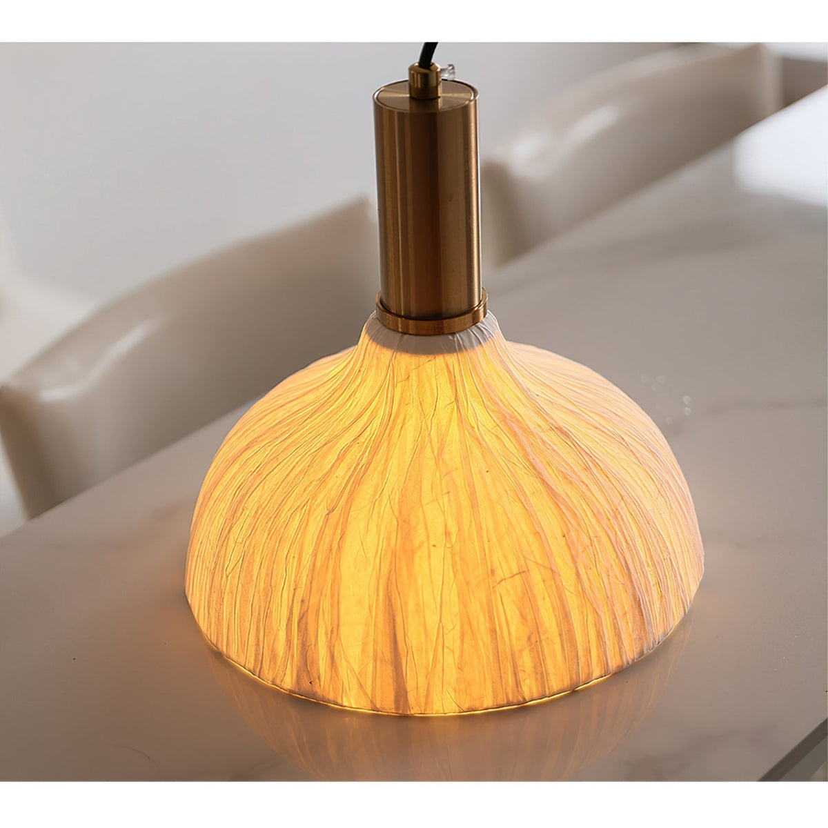 The sculptural form of the Siya Pendant Light on a plain background.