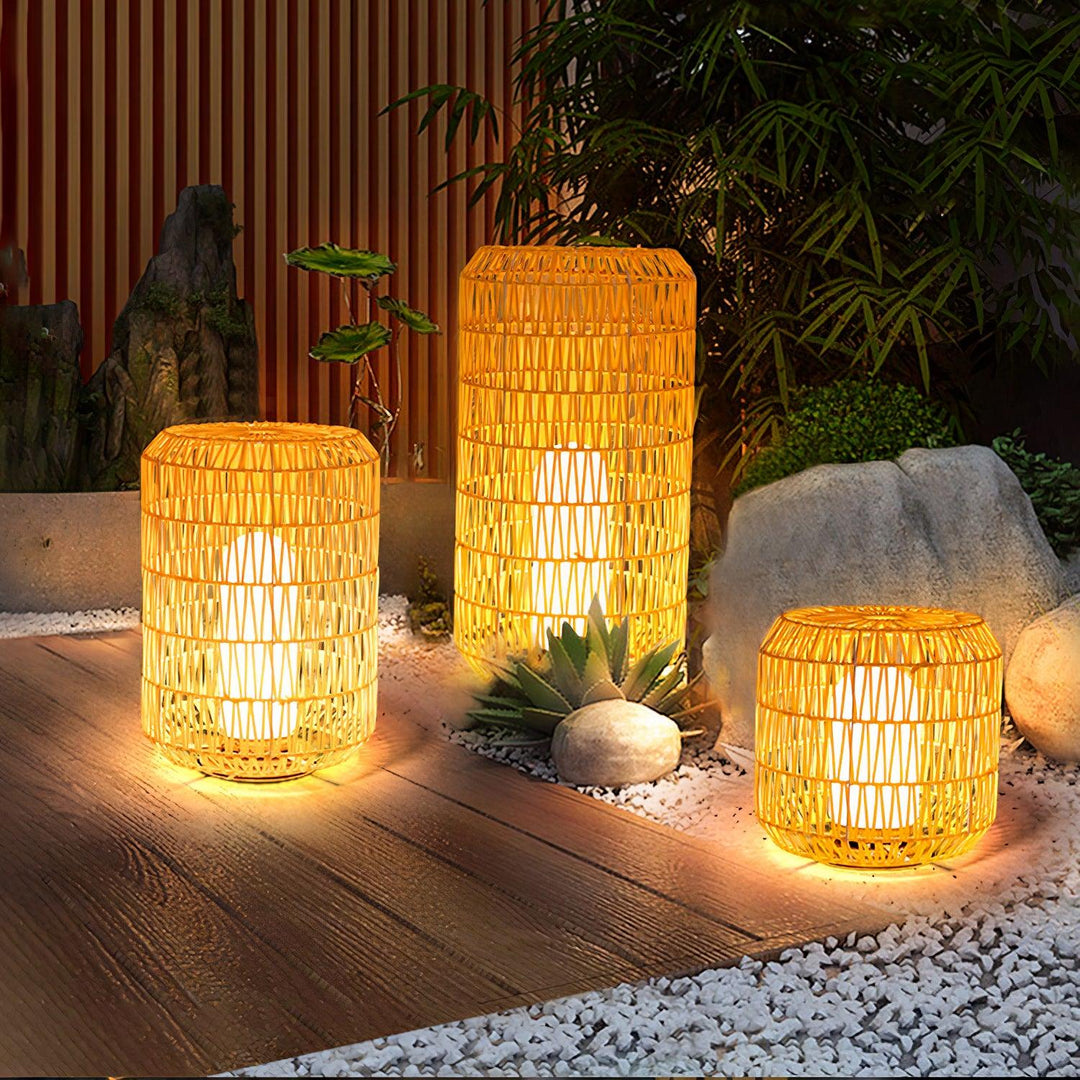The woven rattan outdoor lamp in a garden environment.