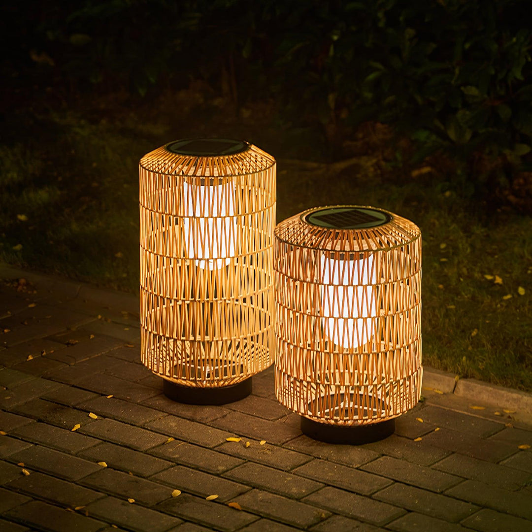 The woven rattan outdoor lamp in a garden environment.