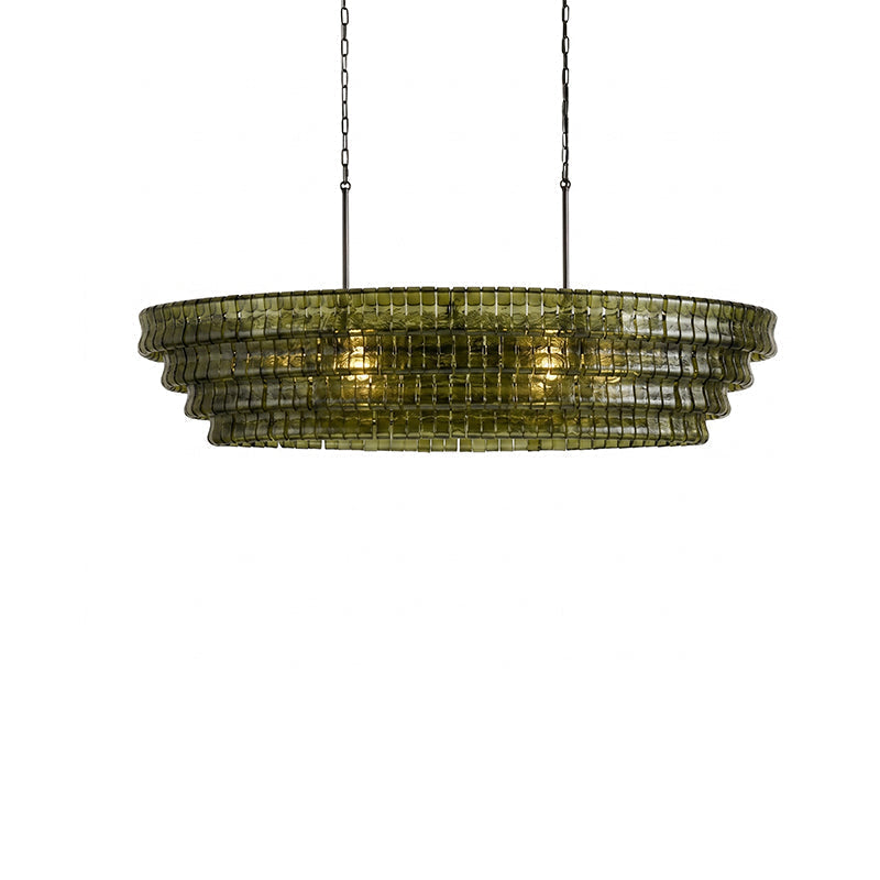 Albano Chandelier with gold finish in a bright, sunlit room.
