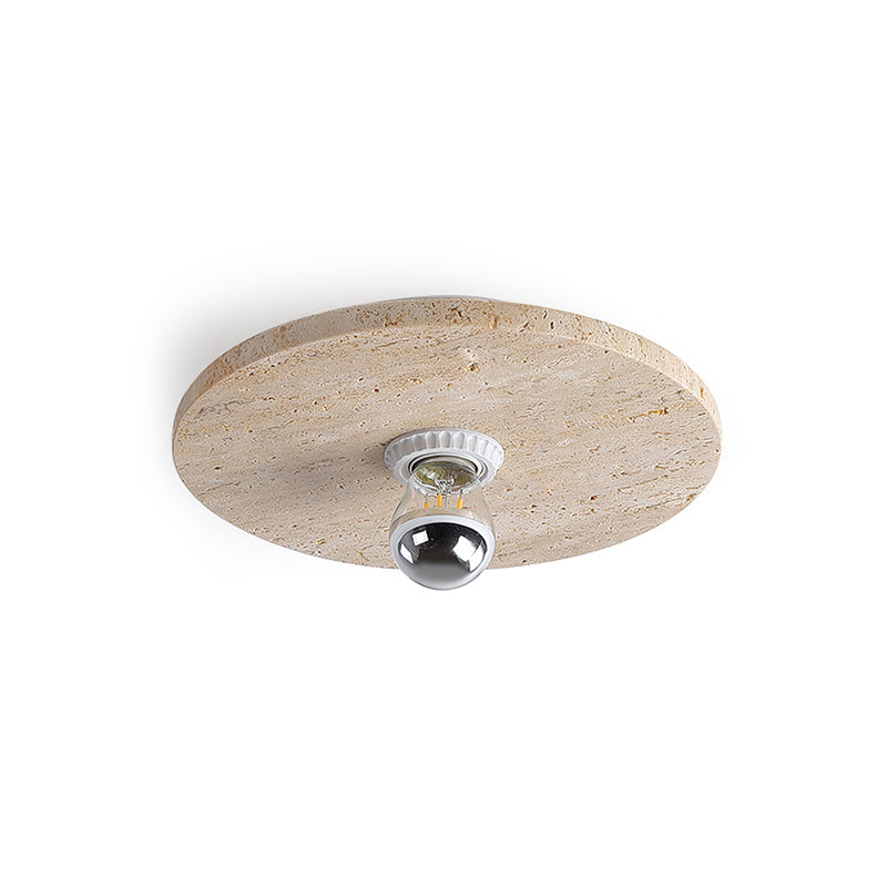 The Avize Travertine Ceiling Lamp against a dark wall for contrast.