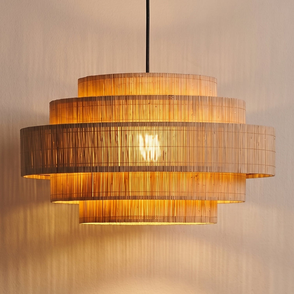 Close-up shot of the intricate woven bamboo texture on the Calista pendant shade.
