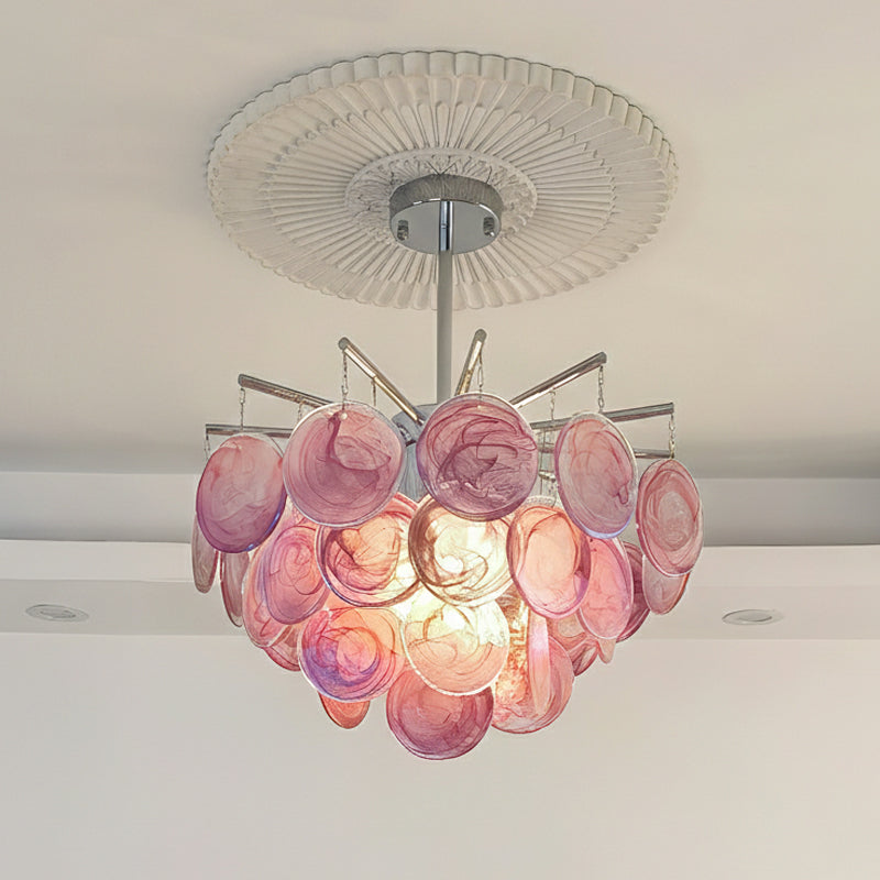 The chandelier casting light patterns on a nearby wall.