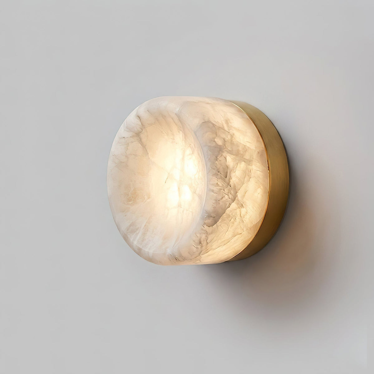 All three finishes (Black, White, Brass) of the wall sconce shown together.