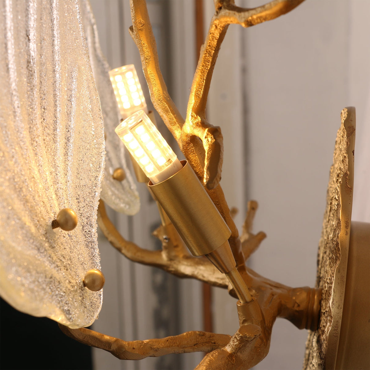 Lifestyle view of the sconce in a bedroom setting.
