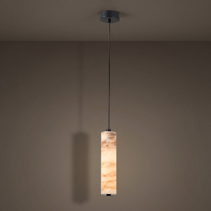 Lifestyle image showing the pendant light in a warm minimalist dining area.