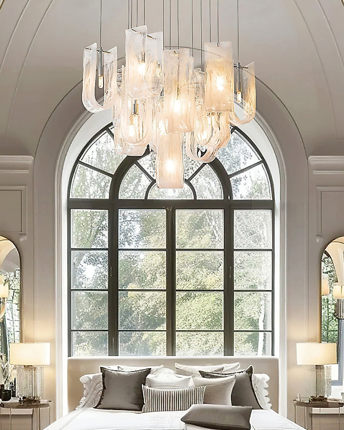The chandelier illuminated at night, casting a warm and inviting glow.