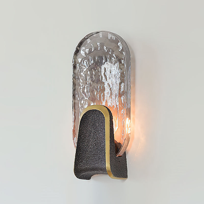 The rippling light effect created by the Ingot Wall Lamp on a surface.