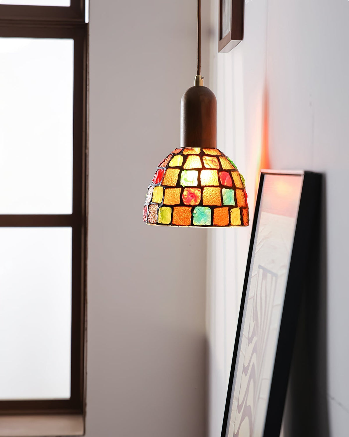 Klima Pendant Light shown against a dark background to emphasize its colors.