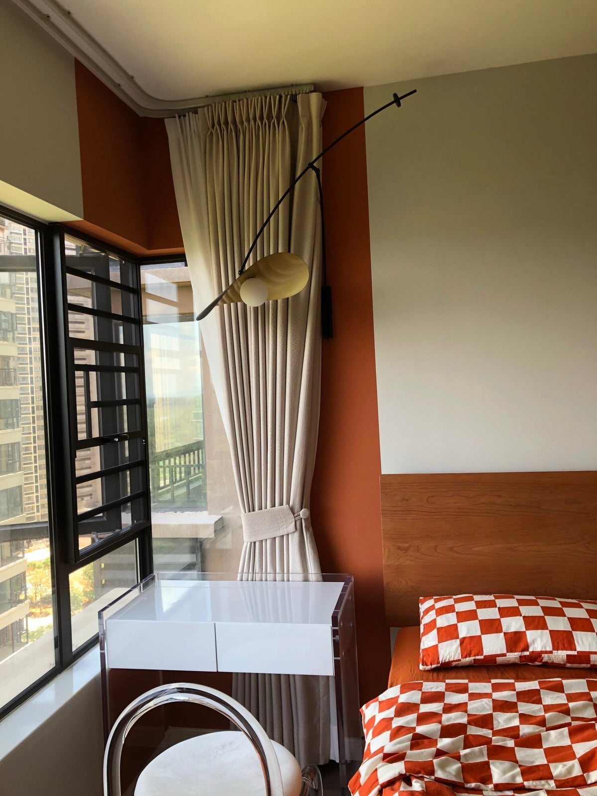 The mid-century inspired design of the Myrna Wall Lamp.
