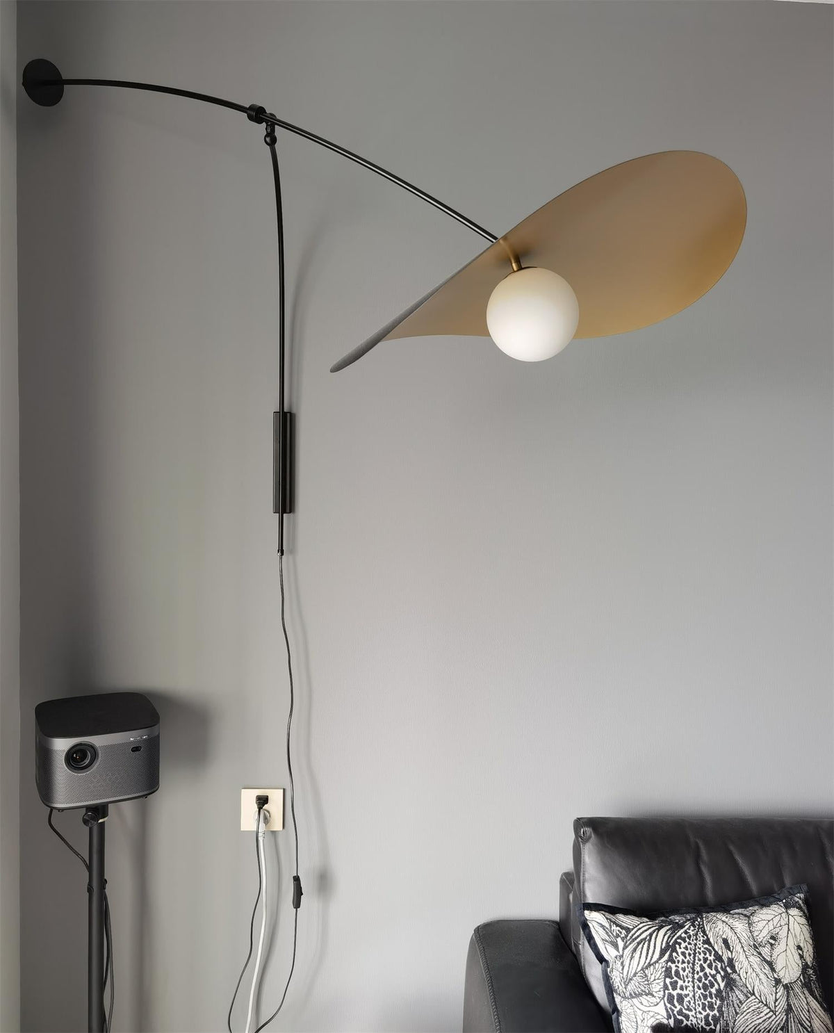 Side view of the Myrna Plug-In Wall Lamp showcasing its sculptural form.