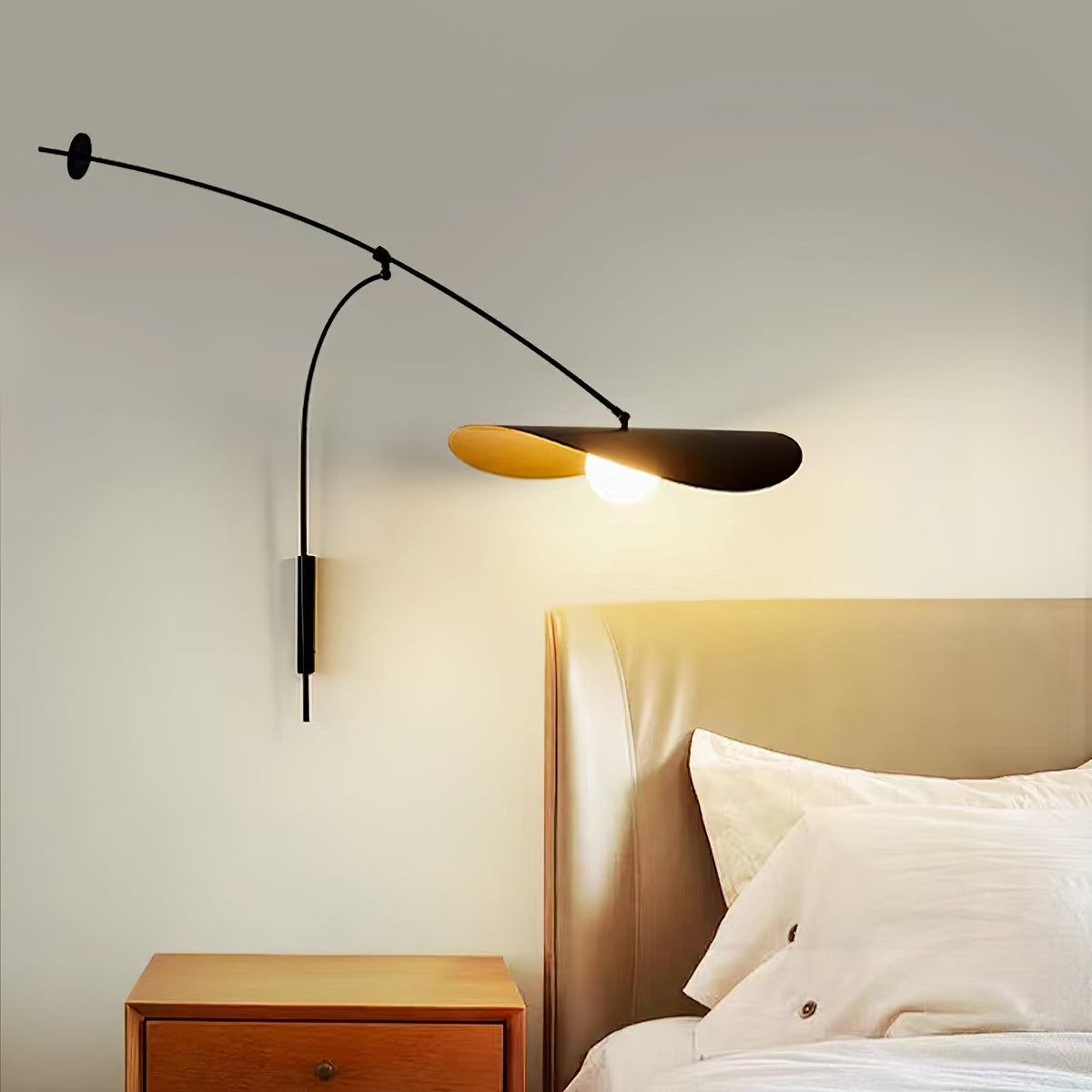 Detail of the black metal arms and joints of the Myrna Wall Lamp.