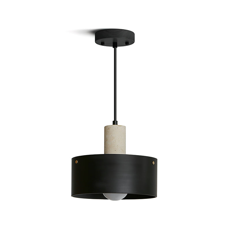 The black and beige Tako Pendant Lamp hanging over a side table.