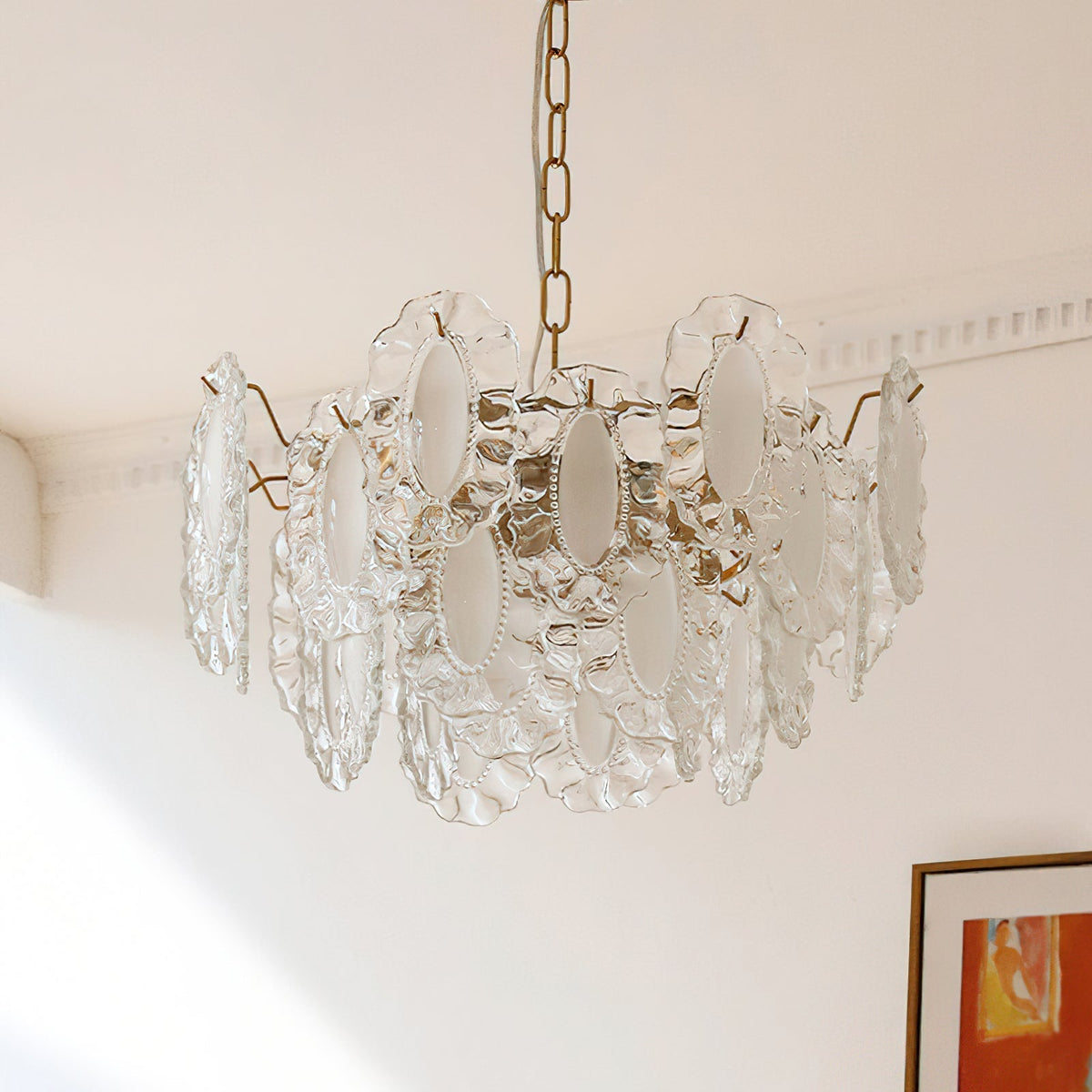 Varvara Glass Chandelier shown in a dining room above a table.