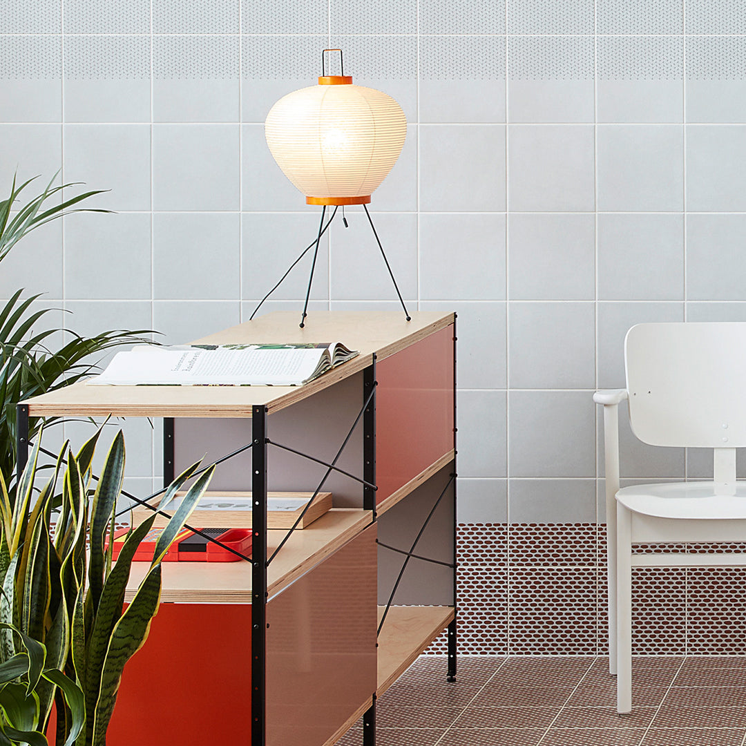 Washi 3A Table Lamp displayed on a side table in a modern living room.