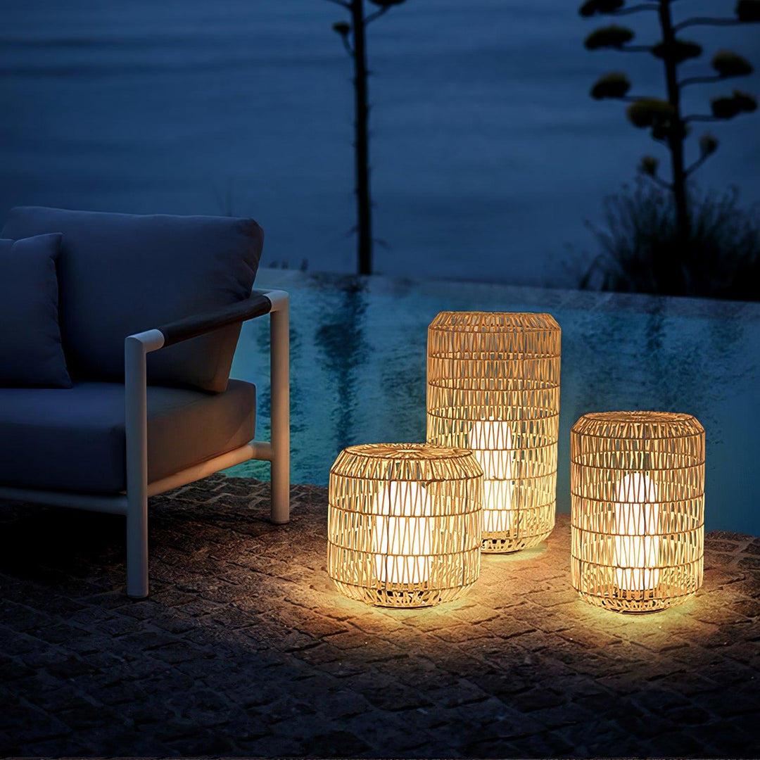 The woven rattan outdoor lamp in a garden environment.