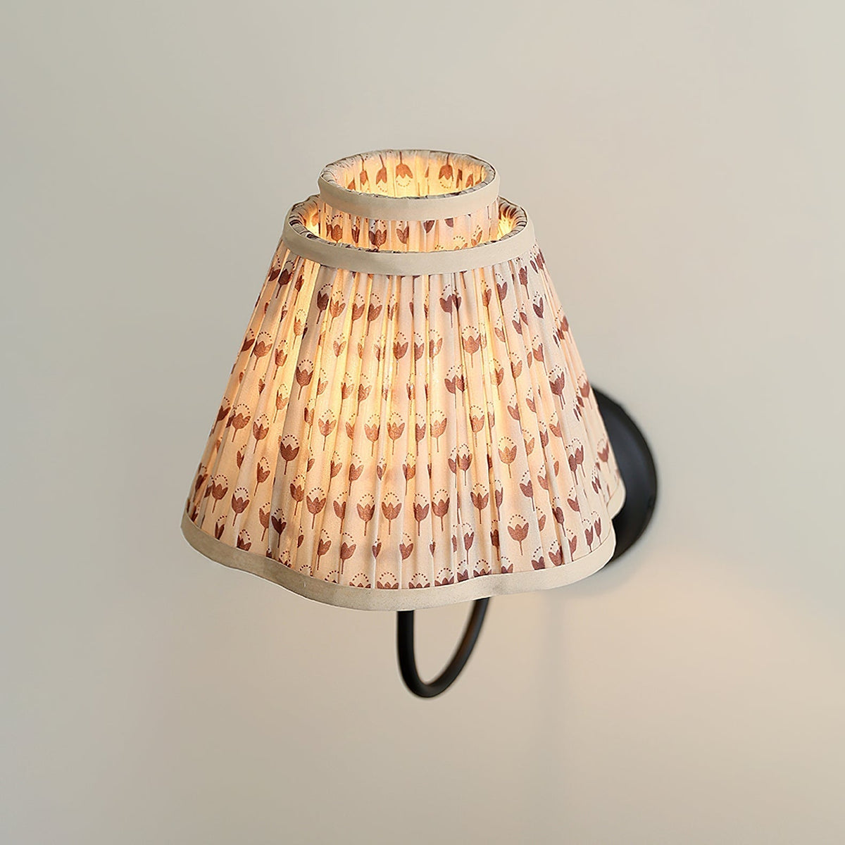 The light brown floral shade shown against a dark background.